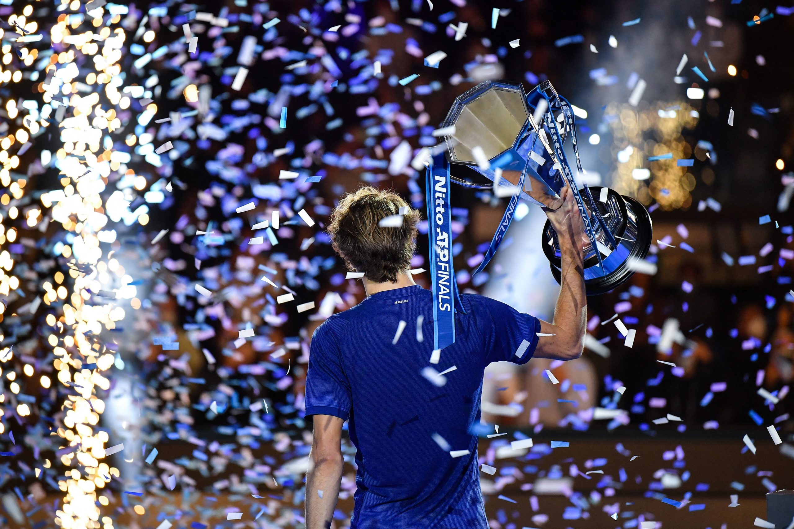 Alexander Zverev lifts the ATP Finals trophy designed and made by Thomas Lyte