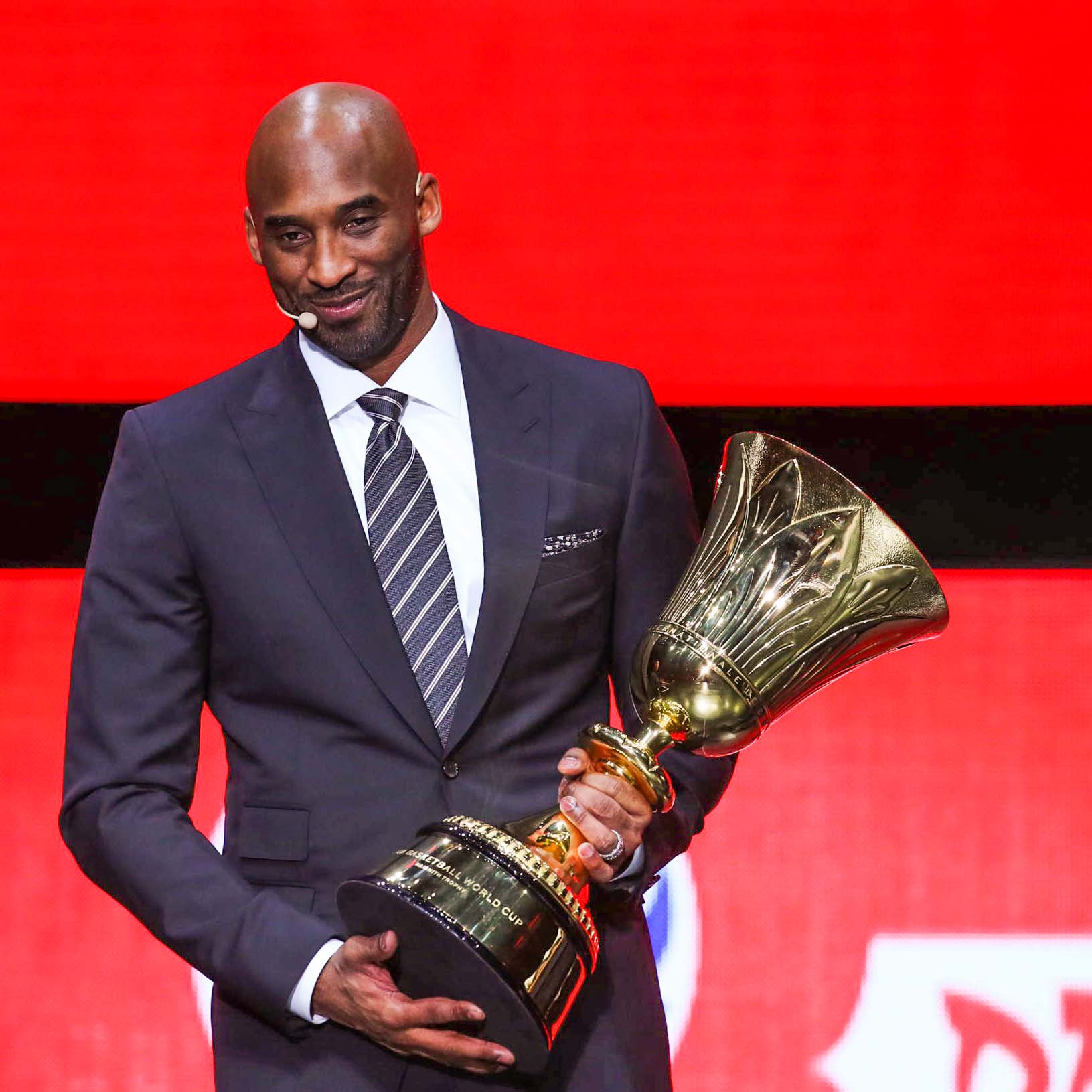 Los Angeles Lakers legend Kobe Bryant holds the FIBA Basketball World Cup trophy