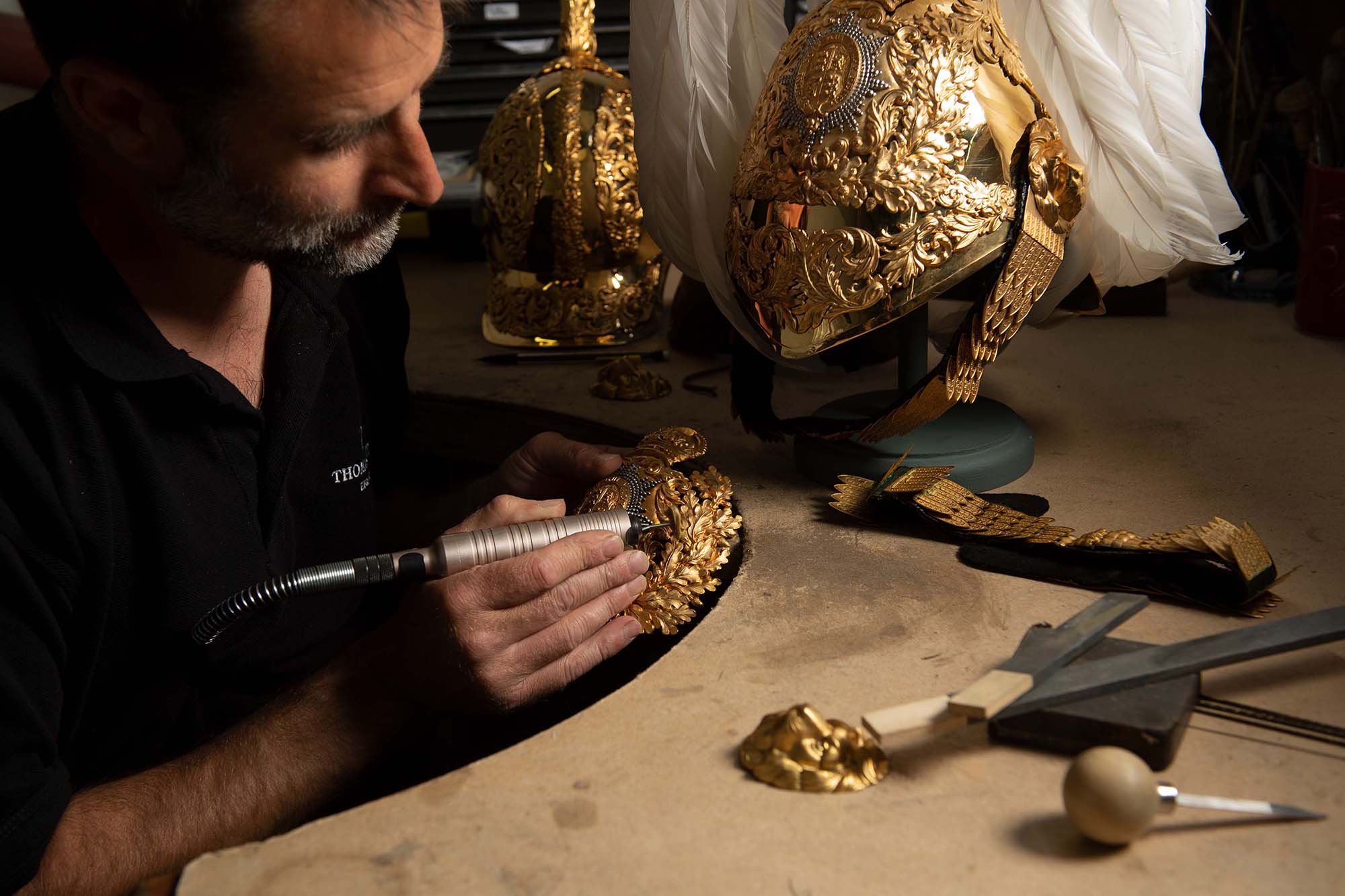 master silversmith restoring queens guard helmet