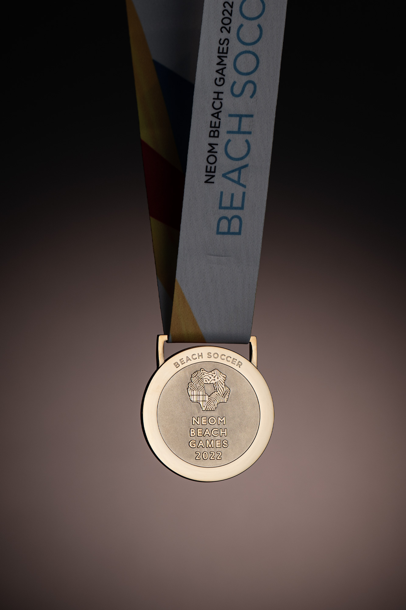 designers and makers of the Neom beach soccer medals tall gold
