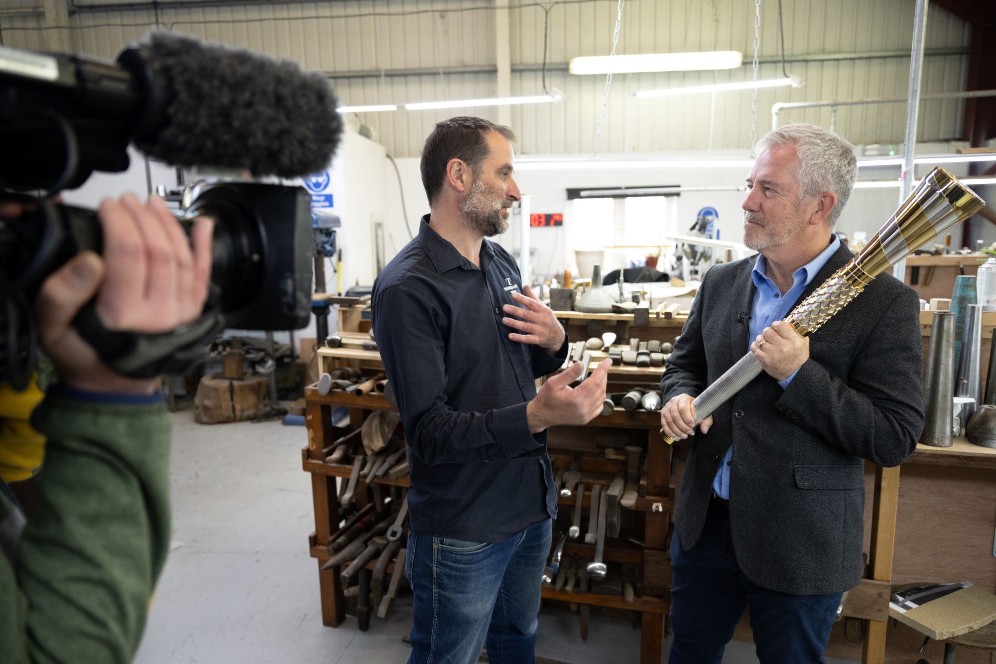 baton of hope mike mccarthy recieves baton from Thomas Lyte (opt)