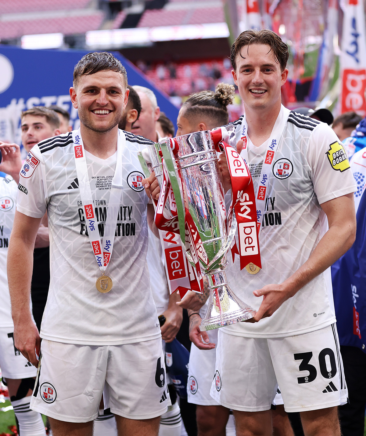 Laurence Maguire of Crawley Town with the league two playoff champions trophy designed and made by Thomas Lyte
