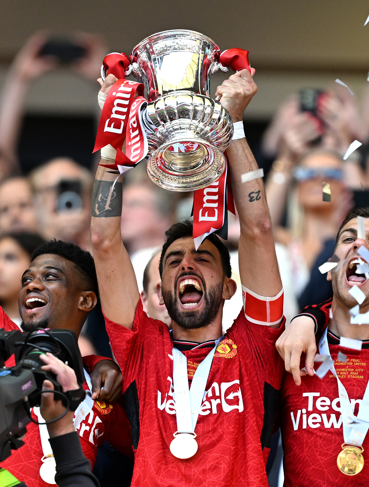 bruno fernandes lifts the fa cup trophy manufactured by Thomas Lyte