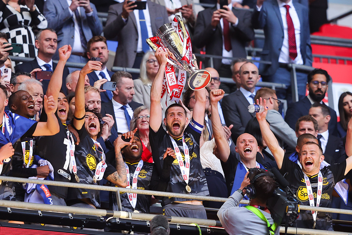 Southampton captain Jack Stephens lifts the EFL Championship Play-Off trophy designed and made by Thomas Lyte