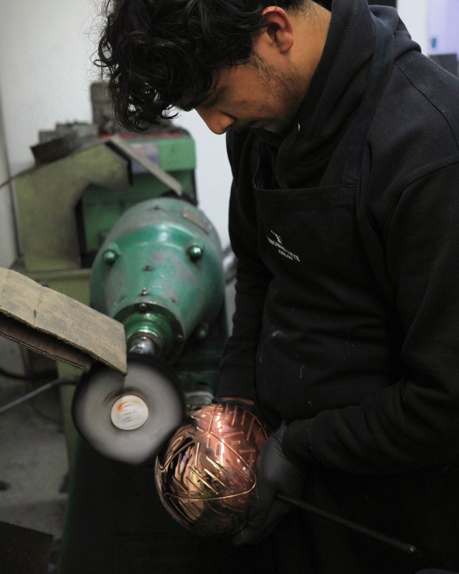 Thomas Lyte apprentice Isa Sheik polishing at Thomas Lyte